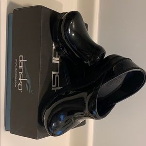 Dansko Black Patent clogs